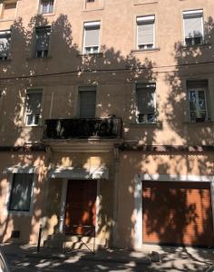 a building with two garage doors in front of it at Maison de ville exceptionnelle in Carpentras