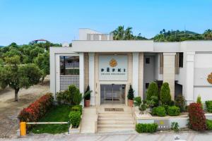 a building with the entrance to a gym at Pefki Deluxe Residences - Adults Only 16plus in Pefkochori