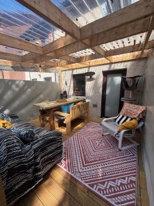 a bedroom with a table and a bed and a rug at Cosy home in Edinburgh in Edinburgh