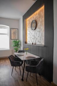 a dining room with a table and chairs at FeWo LUNA in Riesa