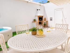 a white table with drinks on it with a fireplace at Jack&Lily's in Évora
