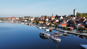 a group of boats are docked in a harbor at Domki pływające HouseBoat4U in Ruciane-Nida