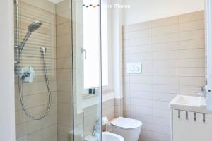 a bathroom with a shower and a toilet and a sink at Urban Chic, Terre Marine in La Spezia