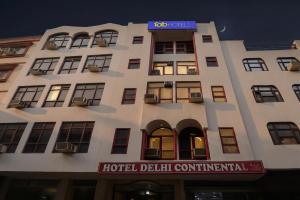 a large white building with a hotel delhi continental at FabHotel Delhi Continental in New Delhi