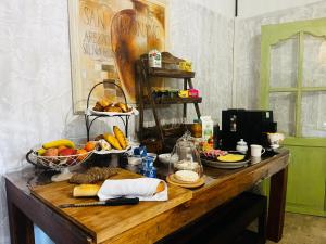 a table with a bunch of food on it at Mas des 4 fontaines in Robion en Luberon
