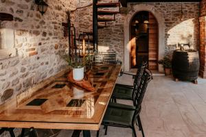 a wooden table in a room with a wine barrel at Villa Gland in Nin