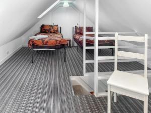 a room with two bunk beds and a ladder at Ballygroggan Cottage - Uk48768 in Machrihanish +7 photos