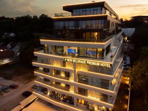 a building with a sign that reads west exchange return hotel at New Belgrade Premium Hotel in Belgrade
