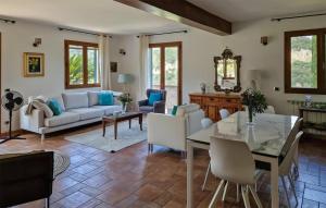 a living room with a table and chairs at Stunning Home In Camporosso in Camporosso