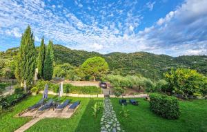 an aerial view of a garden with chairs and trees at Stunning Home In Camporosso in Camporosso