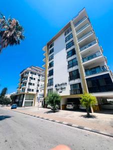 a tall building on a street in front of a building at Aslan House in Nicosia