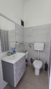 a bathroom with a sink and a toilet at La Casa nella Rocca in Roccagloriosa