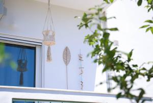 a window of a house with windmills on it at Apartment Simply 206 in Gázion
