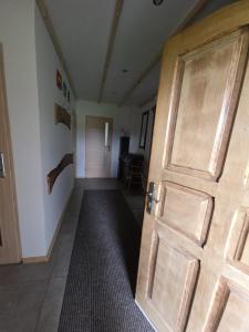 an open door in a hallway with a room at PRZYSTANEK nowEKOprzywno in Parchlino