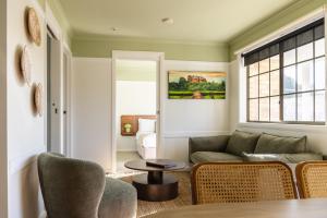 a living room with a couch and a table at Amadiya Port Arthur Villas in Port Arthur +38 photos