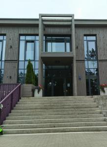 a building with stairs in front of a building at SOL Apartment in Jūrmala +5 photos