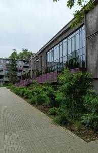 a building with a walkway in front of it at SOL Apartment in Jūrmala