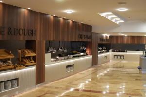 a store lobby with a wine and doughnut counter at Armas Pemar Beach in Kızılot +31 photos