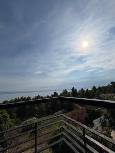 a view from a balcony with the moon in the sky at Afremar Estate in Nea Fokea +7 photos