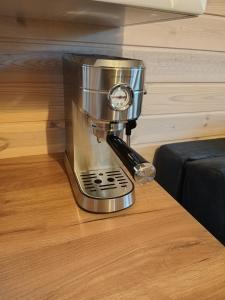a food processor sitting on a wooden floor at Domki u Stasi in Stegna