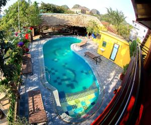 an overhead view of a swimming pool at a resort at Tam Coc Riverside Bungalow in Ninh Binh