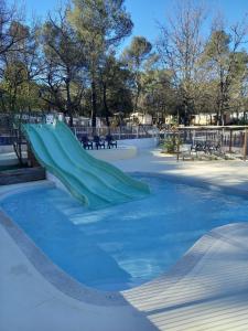 a skate park with a slide in the snow at Mobil Home Sainte Baume 6 personnes in Nans-les-Pins +16 photos