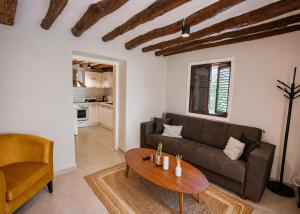 a living room with a couch and a table at Casablanca Villa by HolidayKeys in Kyrenia