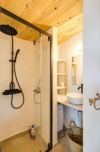 a bathroom with a glass shower and a sink at NEW! Windmill in the midst of nature in Mafra +22 photos