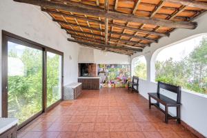 an open hallway with windows and a tiled floor at NEW! Windmill in the midst of nature in Mafra