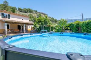 a swimming pool in a yard with a house at Can Freixa - Sóller in Sóller