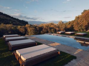 a row of beds in a pool of water at Hunter's Mansion - Transylvania in Gorgan