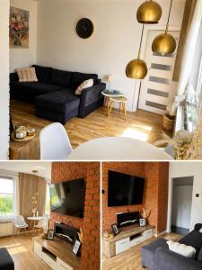 a living room with a blue couch and a brick fireplace at Kamienica Centrum in Pisz