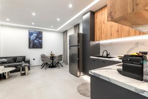 a kitchen and living room with a refrigerator at Elia village in Kalithies