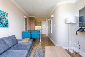 a living room with a couch and a table at Breakers Resort 316 Umhlanga in Durban