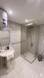 a bathroom with a sink and a shower at Flower Pyramids Inn in Cairo +82 photos