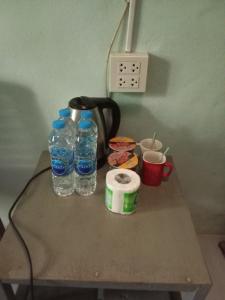 a table with two bottles of water and a coffee maker at Mr Deang shop Doi Inthanon bird center in Ban Na Yang +21 photos