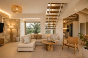 a living room with a couch and a table at Villa Pelagos in Koutsounari