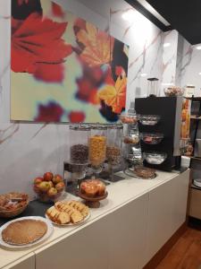 a buffet with many different types of food on a counter at Hotel Albert in Brussels