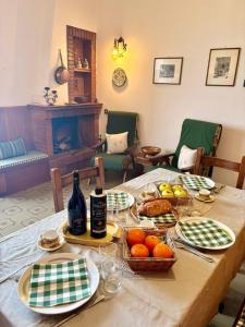a table with plates of food and drinks on it at La Terrazza sul Lago in Panicale