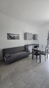 a living room with a couch and a table at La Casa nella Rocca in Roccagloriosa
