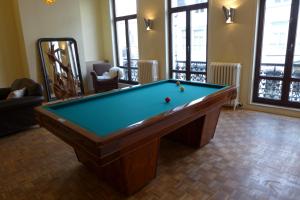 A pool table at CitytripGent Apartment