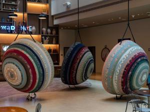 three plates hanging from the ceiling in a store at 25hours Hotel Dubai One Central in Dubai