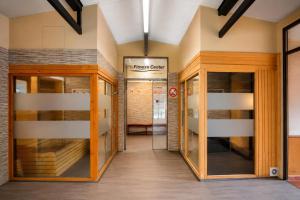 a hallway in a building with two glass doors at Hotel Best Andorra Center in Andorra la Vella