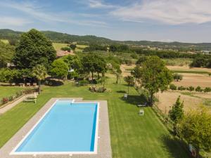 an overhead view of a swimming pool in a grassy field at Holiday Home Rosalba Bacara by Interhome in Bolsena