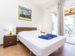 a bedroom with a large bed and a window at Holiday Home Bretos by Interhome in Fonts