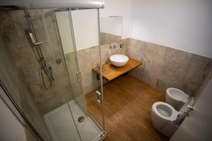 a bathroom with a shower and a toilet at Tenute Cinquanta in Menfi