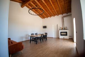 a dining room with a table and chairs at Tenute Cinquanta in Menfi +10 photos