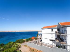 a view of the ocean from the balcony of a building at Apartment Delfin-6 by Interhome in Cesarica