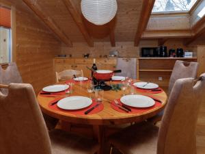 a wooden table in a kitchen with a dining room at Apartment Chalet Almisgässli by Interhome in Grindelwald +25 photos