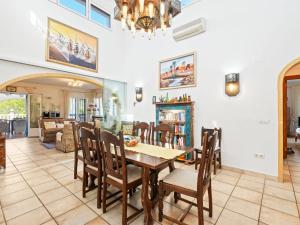 a dining room and living room with a table and chairs at Holiday Home Mirada al Sol by Interhome in Moraira